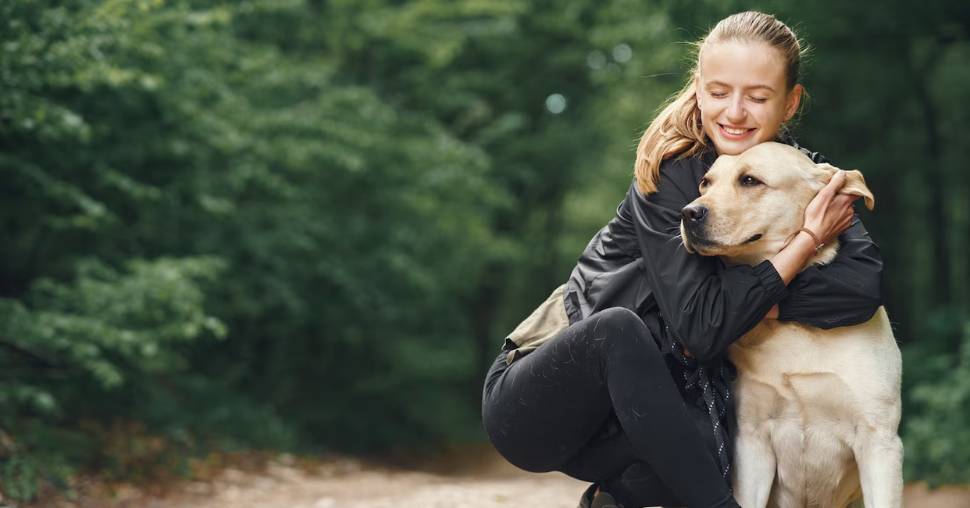 Portrait of a woman with her beautiful dog